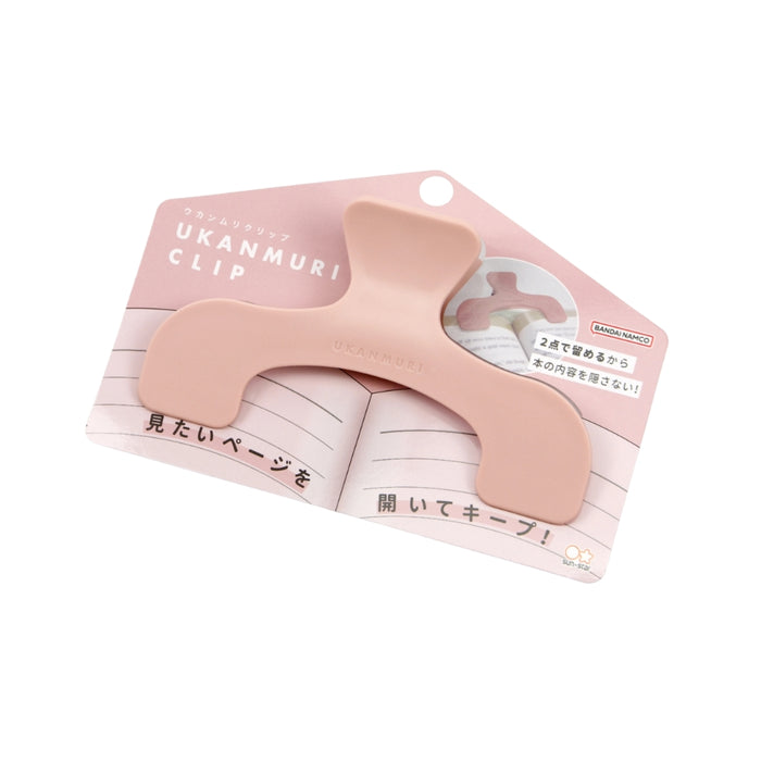 Angled view of the Sun-Star Ukanmuri Clip in peach beige shown attached to its backing card packaging.