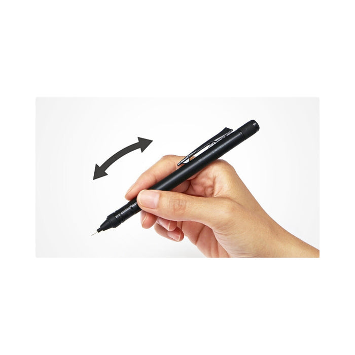 The Journal Shop - Hand holding a black Tombow MONO Graph mechanical pencil while writing on paper.