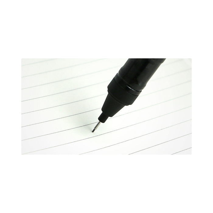 The Journal Shop - Close-up of a black Tombow MONO Graph mechanical pencil writing on lined paper.