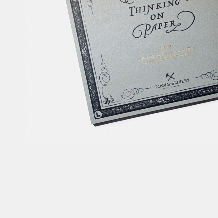 Close-up of the cover typography and decorative border on the calligraphy practice notebook.