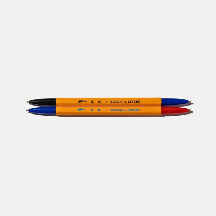 Front view of the Tools To Live By dual-tip ballpoint pen showing both coloured ends.