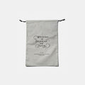 Tools To Live By grey large dust bag with drawstring closure, front view.