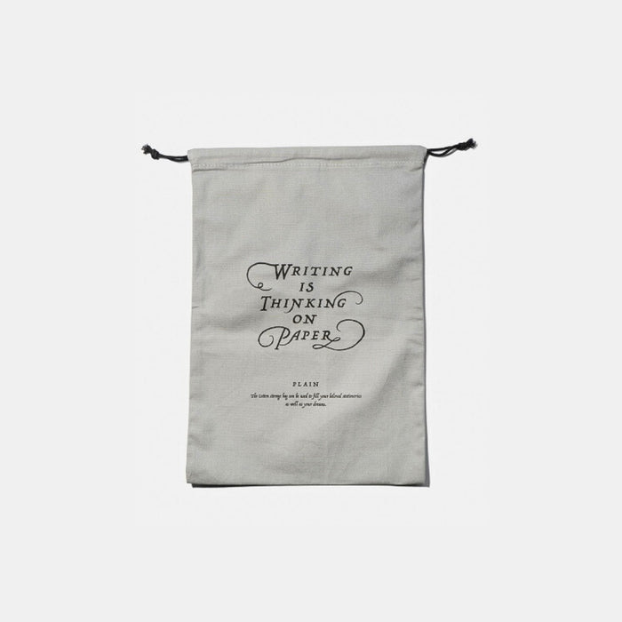 Tools To Live By grey large dust bag with drawstring closure, front view.