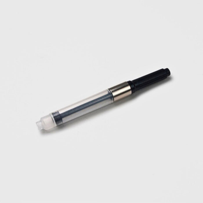 Tools To Live By ink converter shown assembled with clear reservoir and black turning knob on a white background.