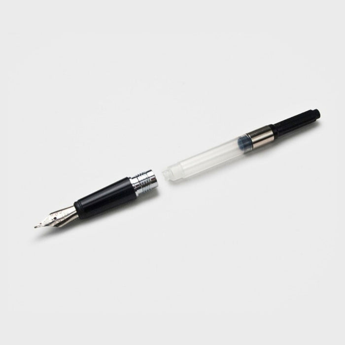 Angled view of the Tools To Live By ink converter, showing the full length and twist mechanism for filling fountain pens.