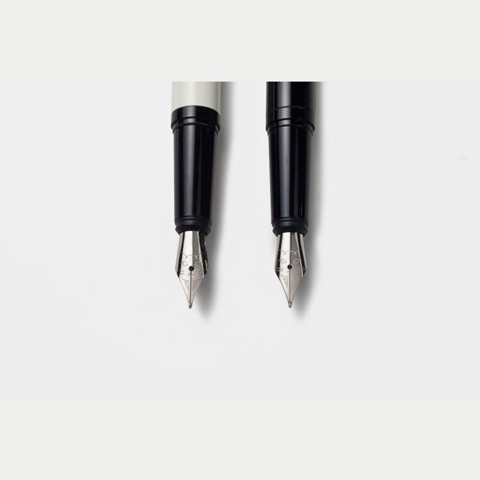 Two Tools to Live By Le Chat fountain pen nibs shown from the front.