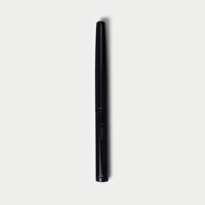 Full-length view of the black Tools to Live By Le Chat fountain pen on a white background.