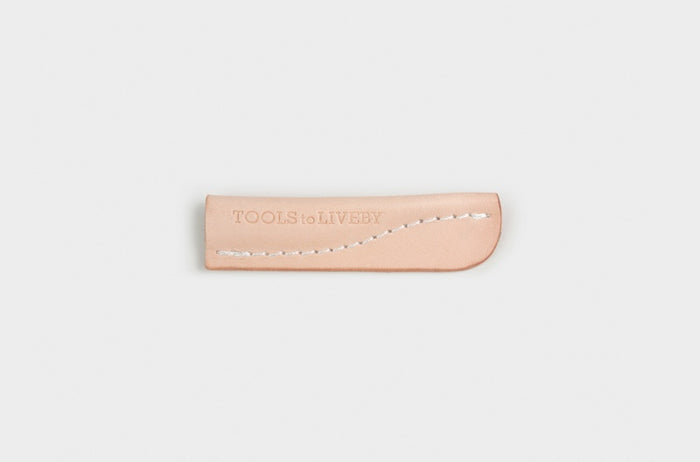 Front view of Tools to Live By leather pencil cap showing stitching detail.