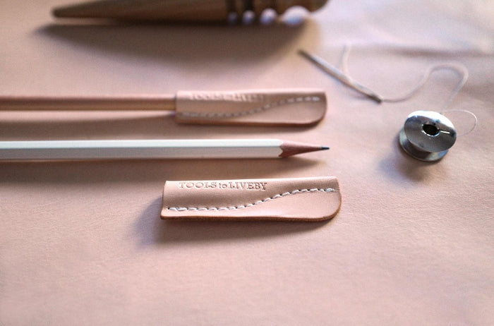 Close-up of leather texture on Tools to Live By pencil caps.