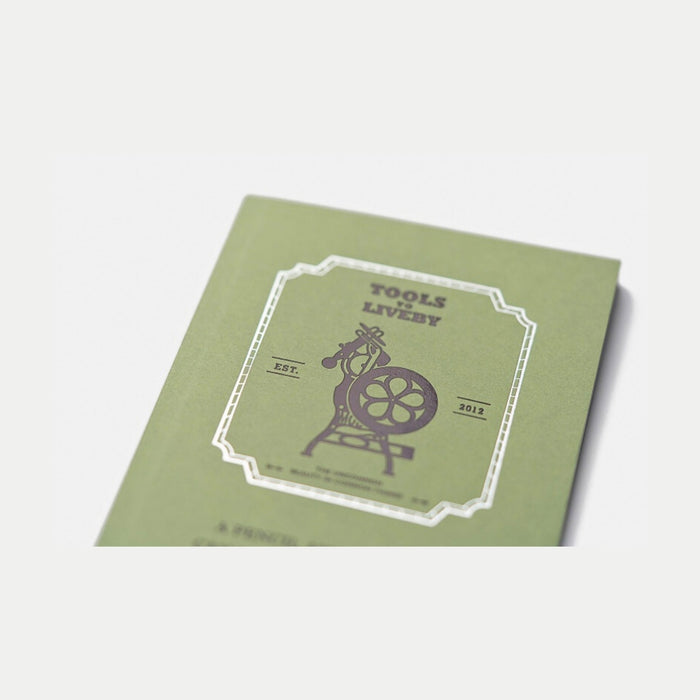 Front design of Tools To Live By letterpress machine dot notebook.