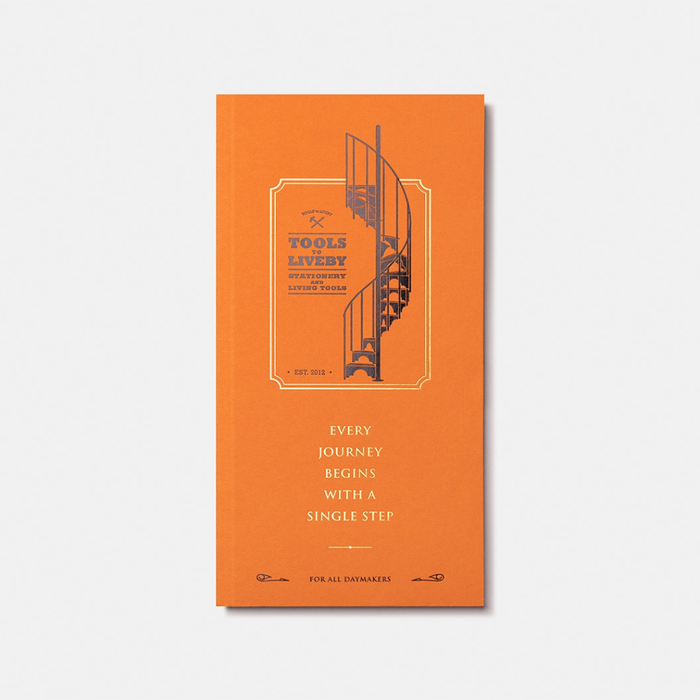 Tools To Live By Spiral Staircase Grid Notebook in orange with illustrated cover design