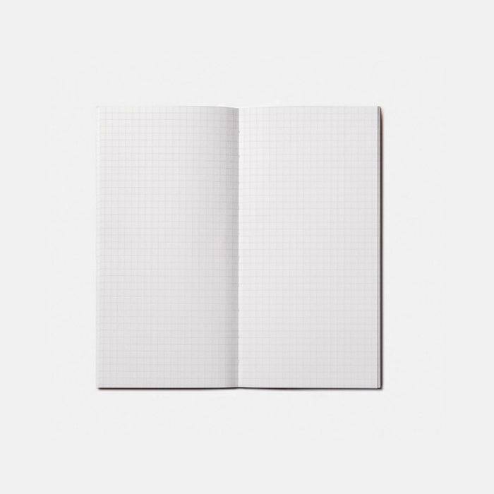 Tools To Live By Spiral Staircase Grid Notebook open showing clean grid paper layout