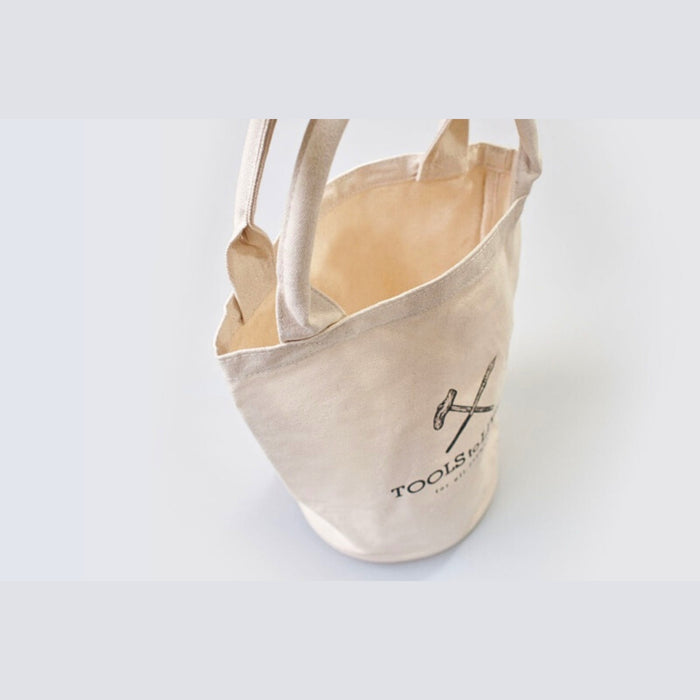 Interior view of the cream Tools To Live By canvas tote bag showing spacious compartment.