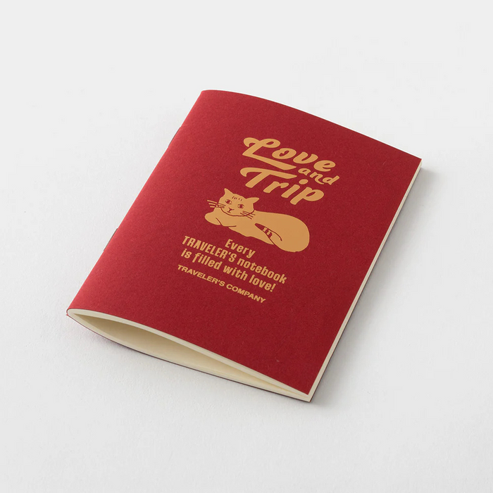 TRAVELER'S Company Notebook Love & Trip Passport Size Refill, shown from the front.