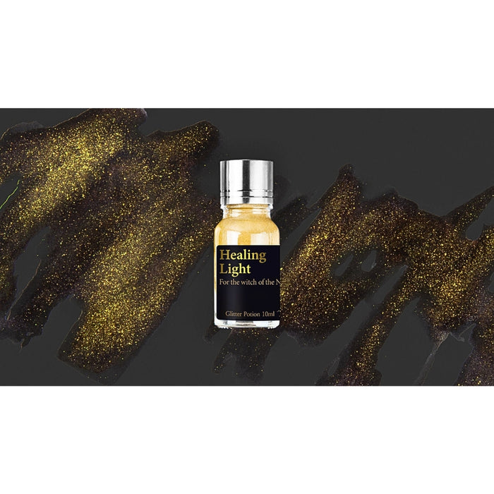 Healing Light - Wearingeul Becoming Witch Glitter Potion golden yellow ink swatch with sparkling brush strokes.