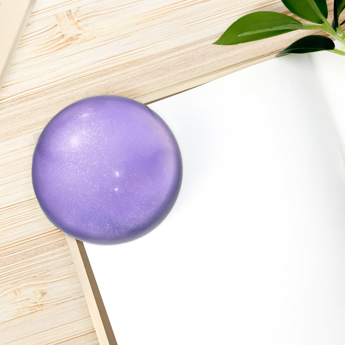 The Glass Bead Game - Purple Wearingeul crystal ink paper weight displayed on white background.