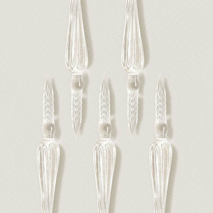 Wearingeul glass pen set with multiple clear glass nibs displayed on light background.