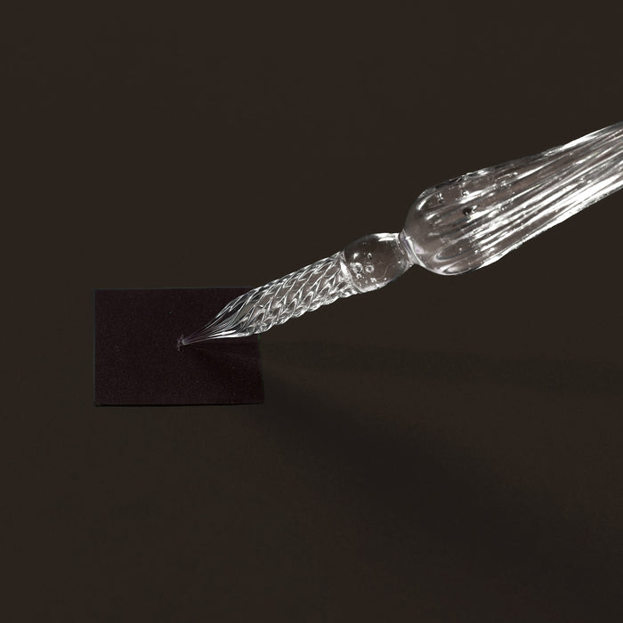 Close-up of a single Wearingeul glass pen nib showing twisted glass tip.