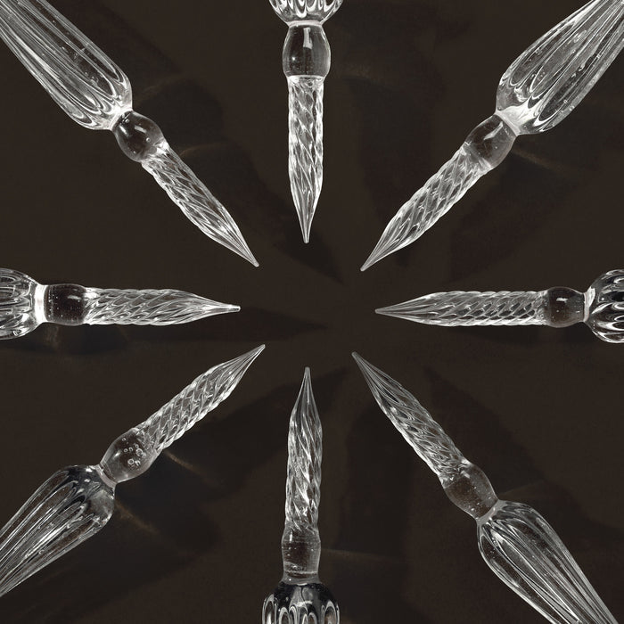Wearingeul glass pen nibs arranged in a circular display pattern.