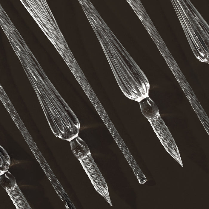 Wearingeul glass pen nibs displayed against dark background to show detail.