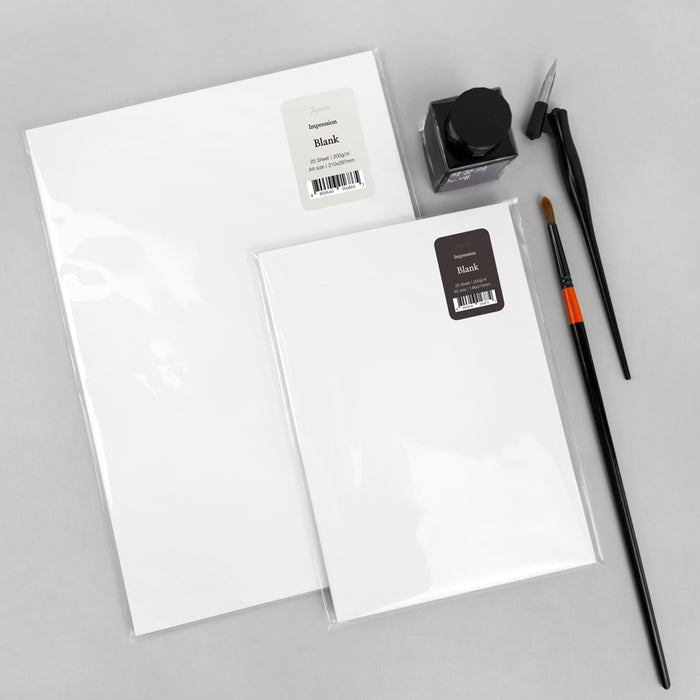 Wearingeul Impression Paper loose sheets shown with fountain pen, brush and ink bottle.