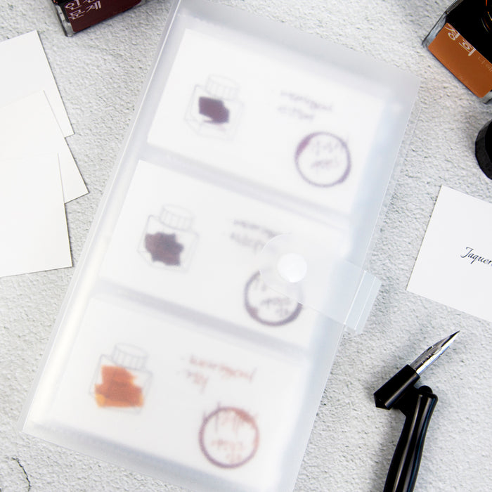 Open pages of Wearingeul ink transparent card binder with swatch cards.