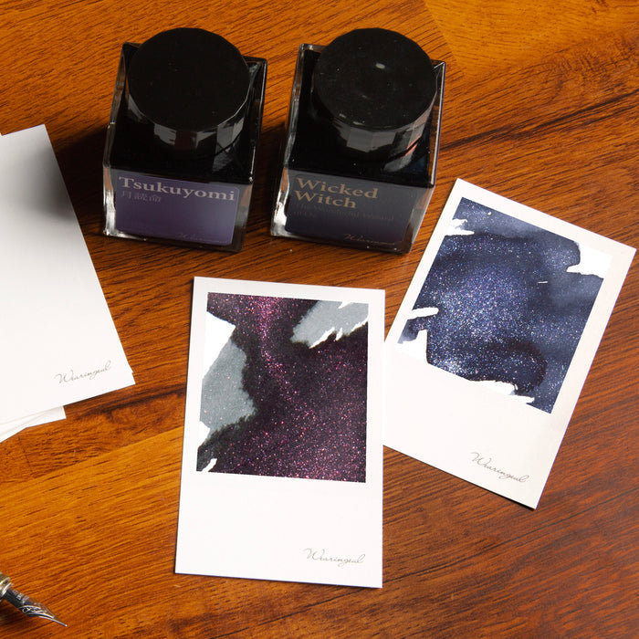 Wearingeul Instant Film Colour Swatch cards displayed with fountain pen ink bottles.
