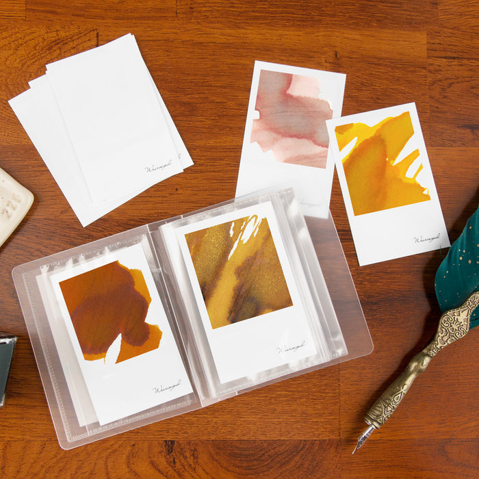 Wearingeul Instant Film Colour Swatch cards arranged on desk with writing tools.