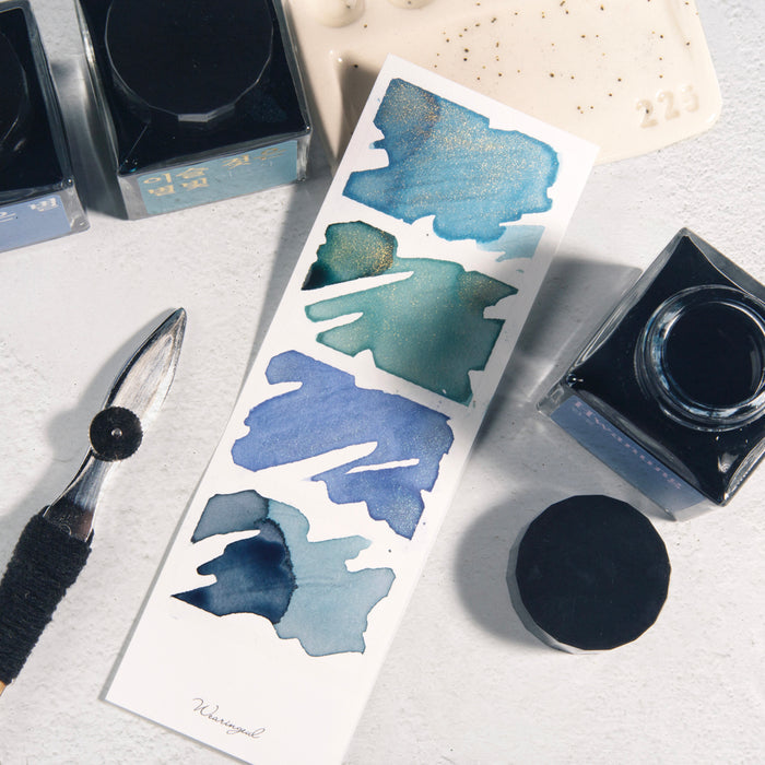 White - Wearingeul Instant Four Photos Colour Swatch strips filled with blue fountain pen inks.