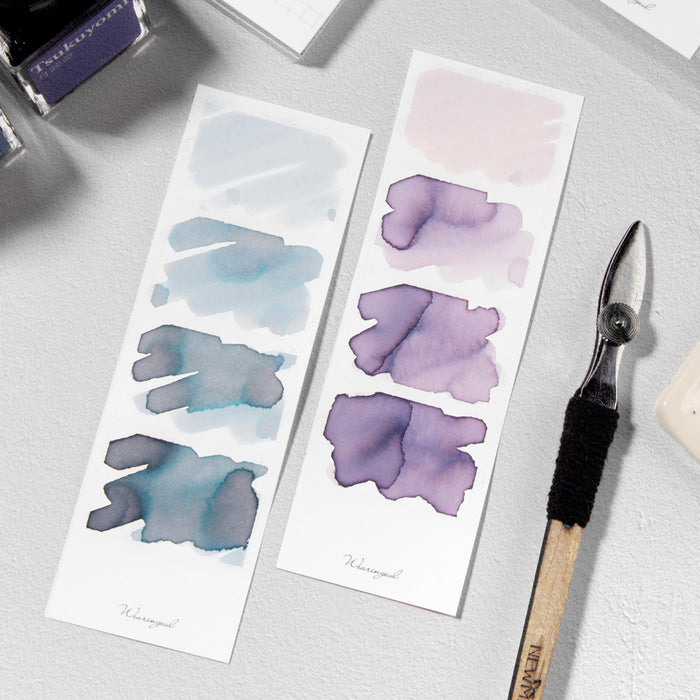 White - Wearingeul Instant Four Photos Colour Swatch strips filled with blue and purple fountain pen inks.