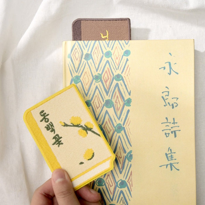Stack of Wearingeul Korean Literature embroidery bookmarks displayed together on a light background.