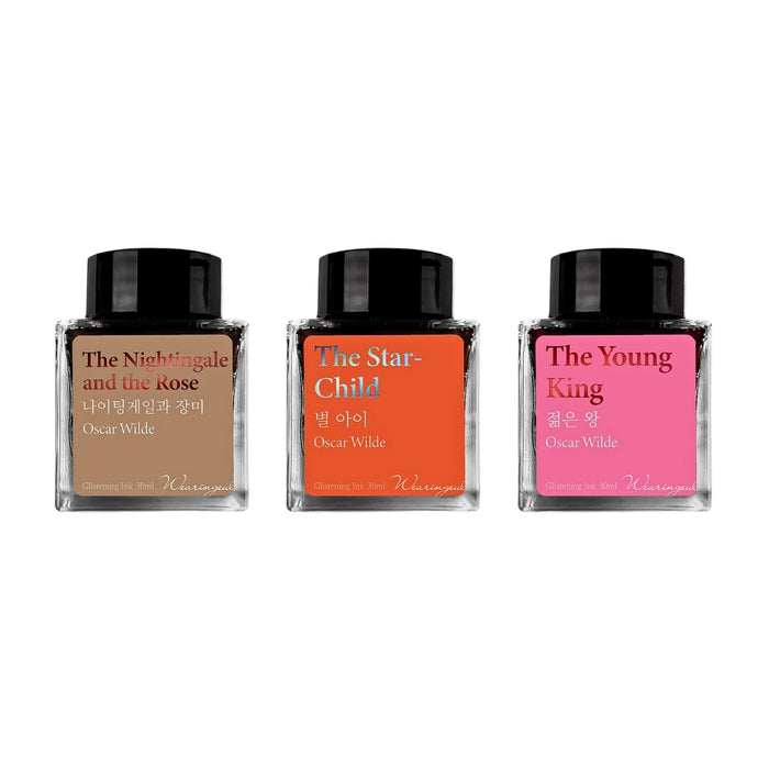 Assorted Wearingeul Oscar Wilde fountain pen ink bottles in brown, red and pink tones.