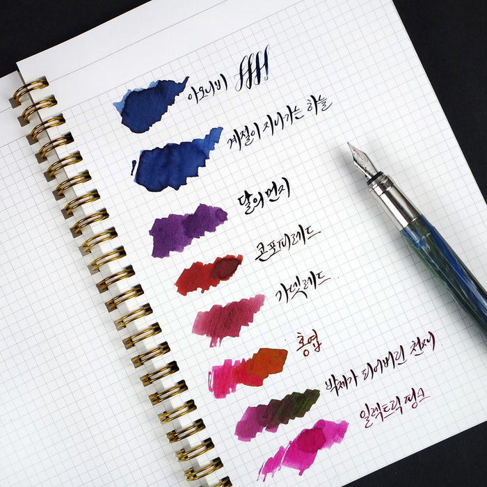 Wearingeul Reservoir Ring Notebook A5 showing 4mm grid pages with fountain pen ink swatches.