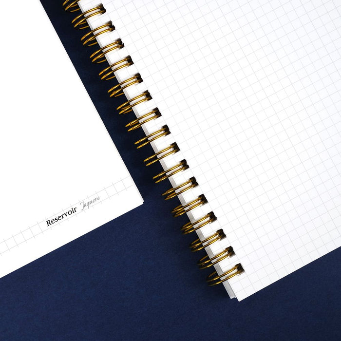 Wearingeul Reservoir Ring Notebook A5 opened at an angle highlighting gold ring binding.