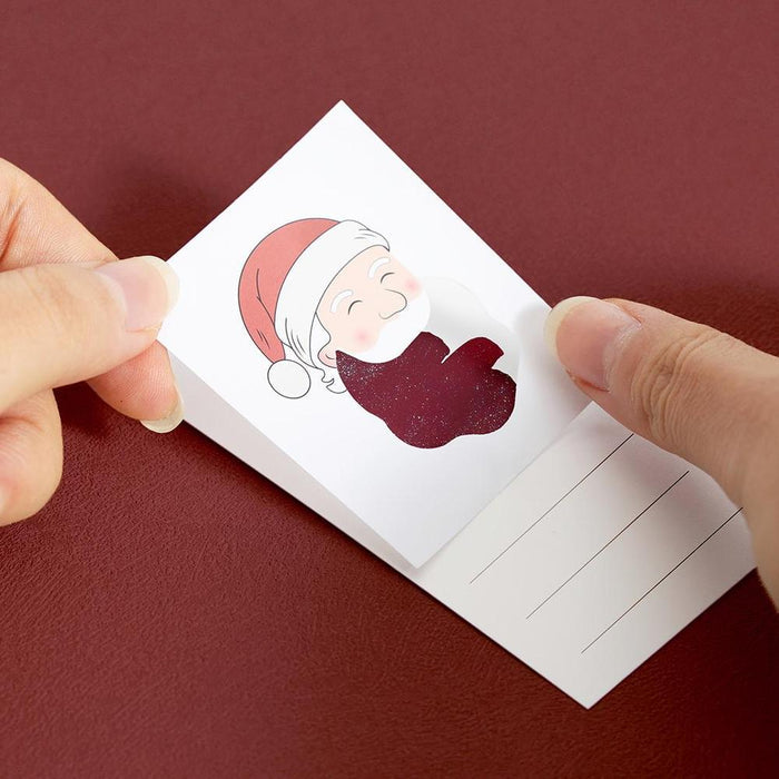 Wearingeul Santa Claus Sticker and Swatch card held in hand showing size and design.