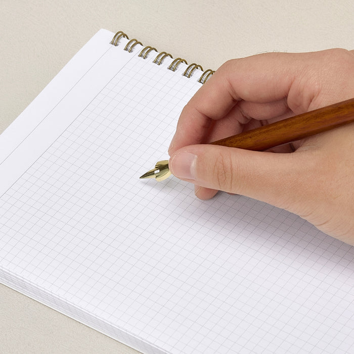 Writing demonstration using a Wearingeul wooden dip pen holder.