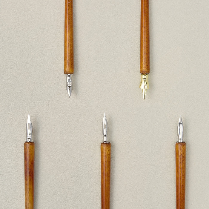 Wearingeul wooden dip pen holders shown fitted with metal dip nibs.