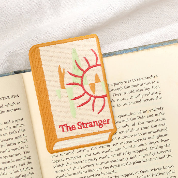 Close-up of stitched detailing on a Wearingeul World Literature embroidery bookmark.