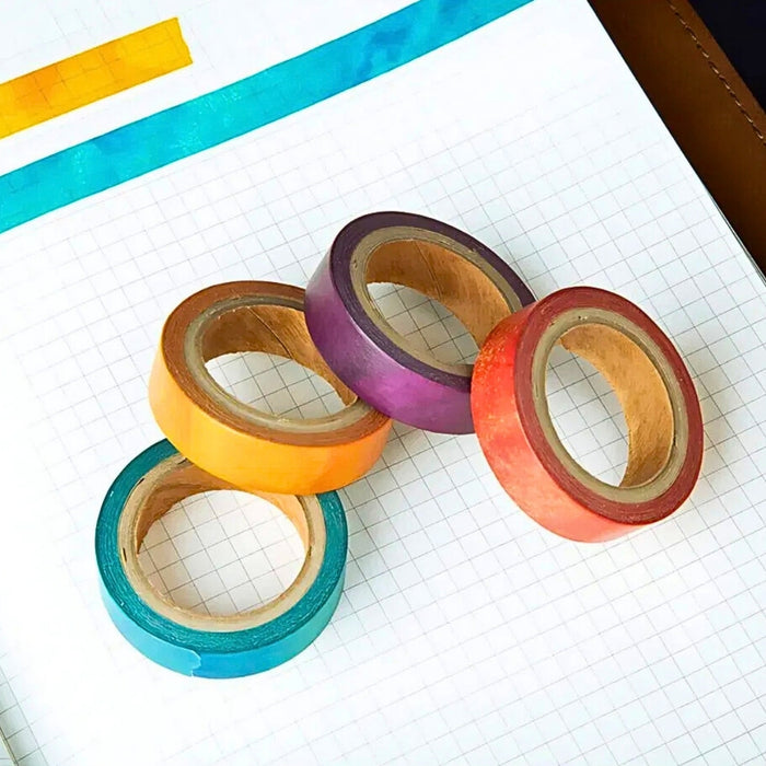 Wearingeul World Literature ink masking tape rolls in assorted colours on notebook.