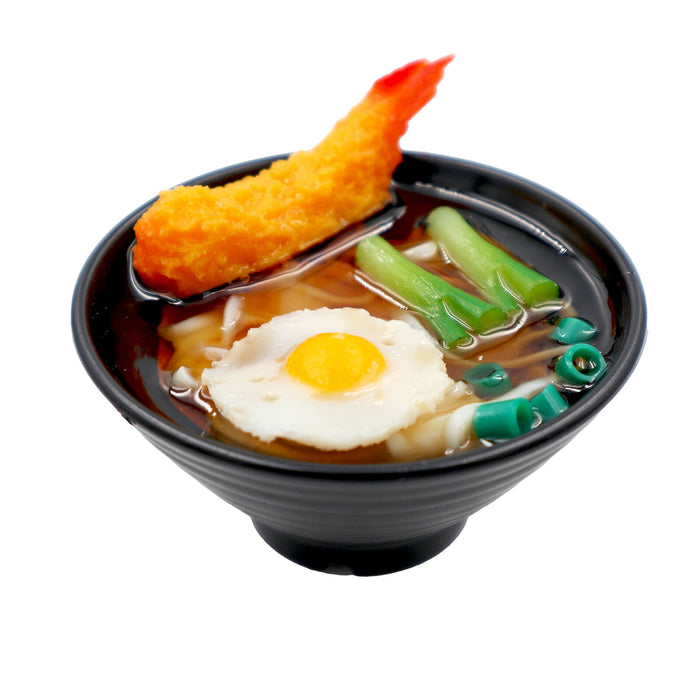 Miniature Japanese noodle bowl food sample magnet topped with a halved boiled egg.