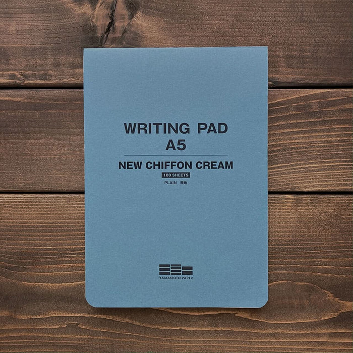 Front cover of Yamamoto A5 Writing Pad in blue with text stating New Chiffon Cream and 100 sheets