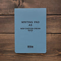 Front cover of Yamamoto A5 Writing Pad in blue with text stating New Chiffon Cream and 100 sheets