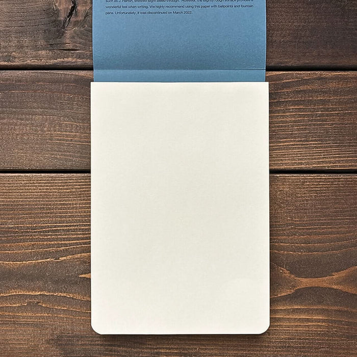 Open Yamamoto A5 writing pad showing cream-coloured New Chiffon Cream paper against wood